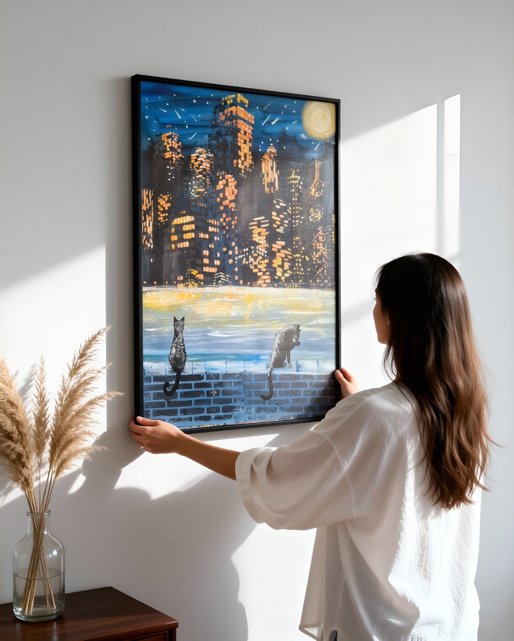  Original acrylic painting 'Night on the Town' — two black cats sitting on a brick wall overlooking a glowing city skyline, full moon and shooting stars in deep blue night sky, golden light reflections on water, heartfelt art by J