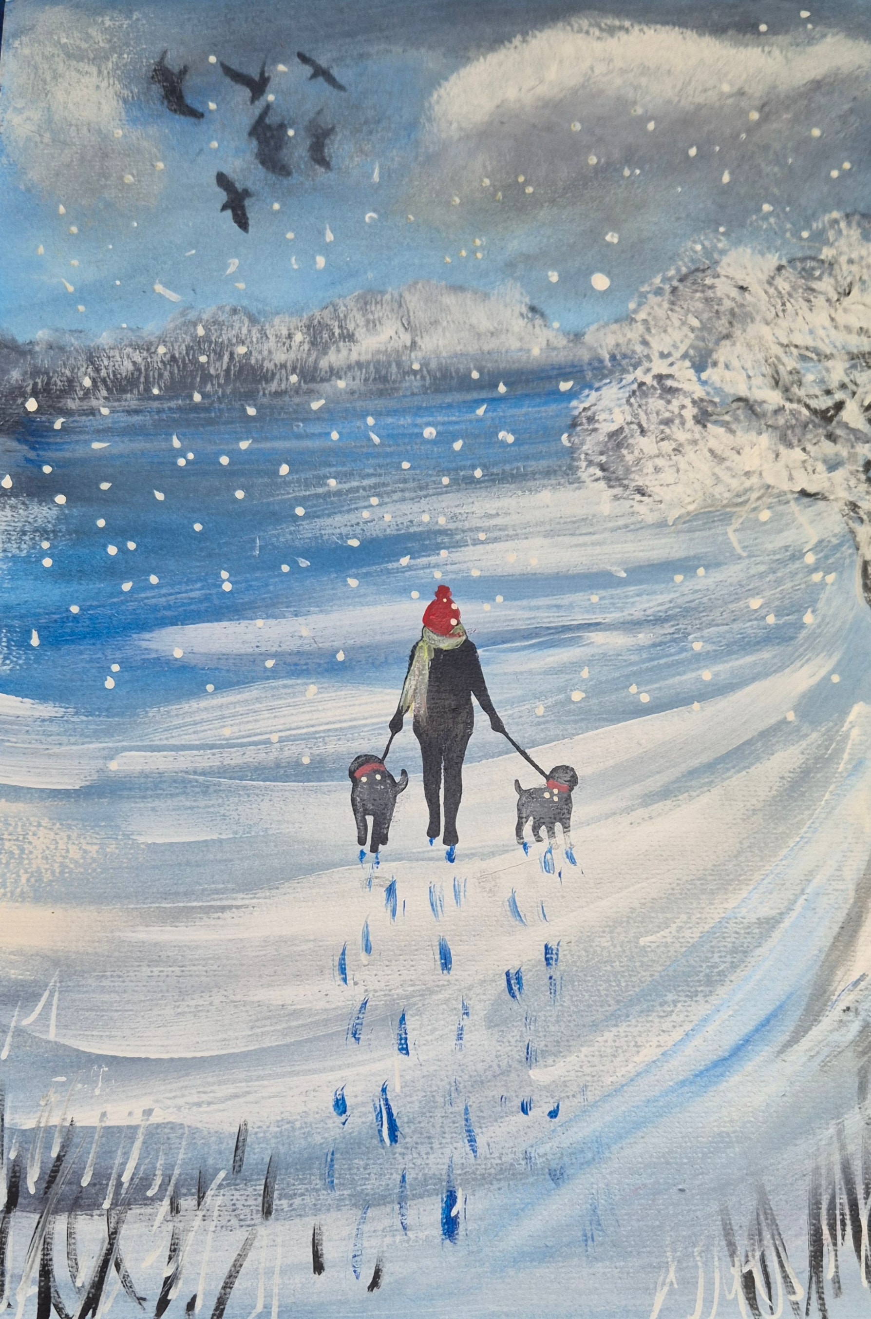 lady walking her dogs in the snow 