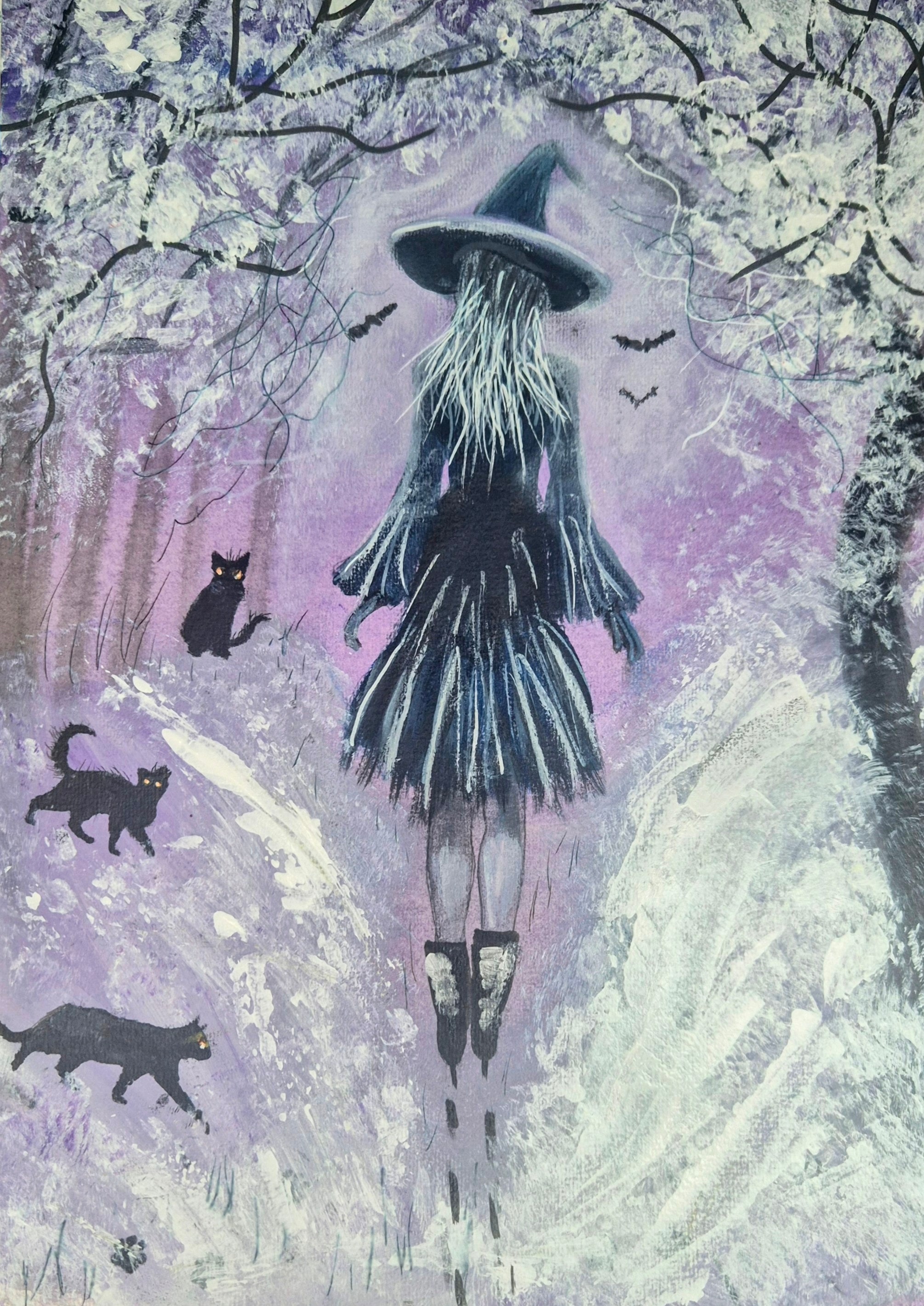 Witch walking in woodland with her 3 cats 