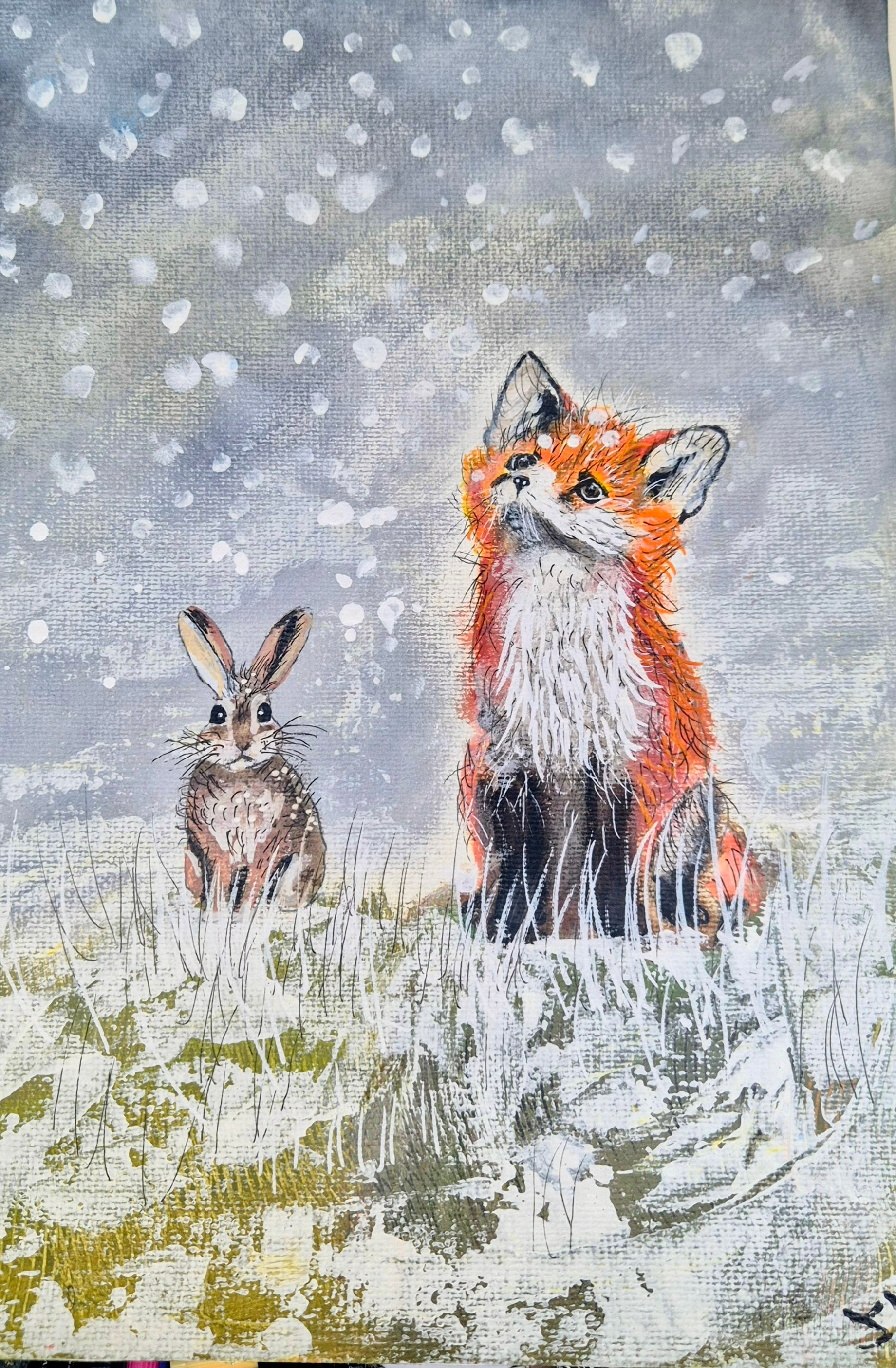 A young red fox sits in a grassy meadow dotted with pink and white spring flowers, looking up at drifting blossom petals beneath cherry blossom trees and a soft blue sky, in a warm painterly children’s book illustration style.